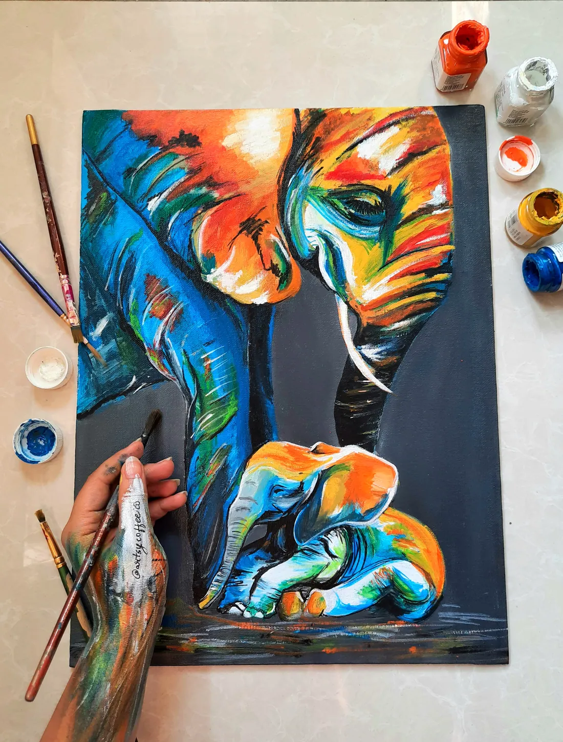 Acrylic painting of a mother elephant and her calf